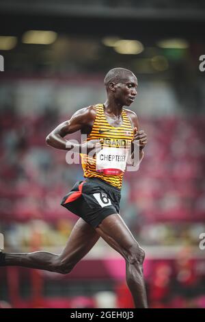 Joshua Cheptegei running in the 5000 meters of the Tokyo 2020 Olympic Games. Stock Photo