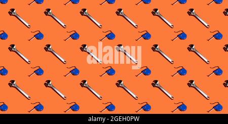 Adjustable keys and measuring tape on an orange background, pattern, hard shadows. Construction tools, repairs. Background for the design. Stock Photo