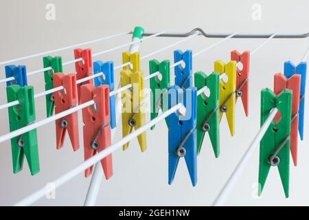 colored clothespins lined up on the clothesline Stock Photo