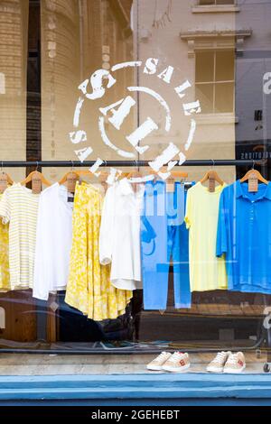 Clothes shop with a sale on, UK 2021 Stock Photo