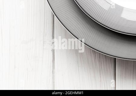 The modern classical porcelain set of plates stands on a white table Stock Photo