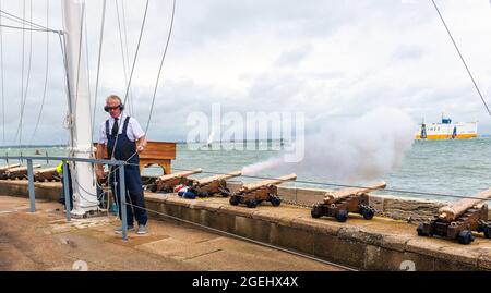The famous cannons being fired for yacht racing outside The Royal Yacht Squadron during Cowes Week (2021),Cowes, Isle of Wight, Hampshire, England, UK Stock Photo