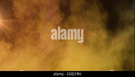 Image of powder bomb and glowing spot of light in the background Stock Photo