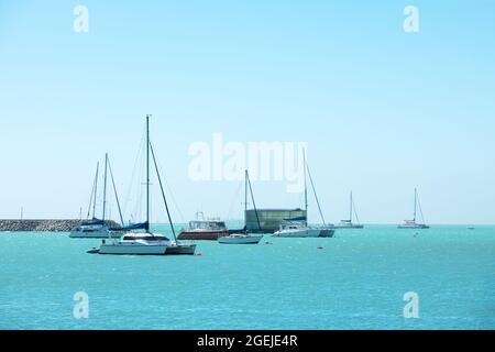 Turquoise water of the Atlantic Ocean and yachts in the foreground. Summer vacation concept background Stock Photo