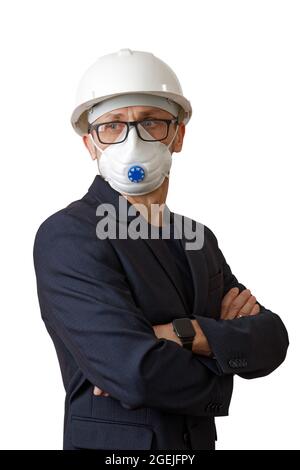 Portrait of a man in suit, a white construction helmet and respirator, isolated on white. Stock Photo