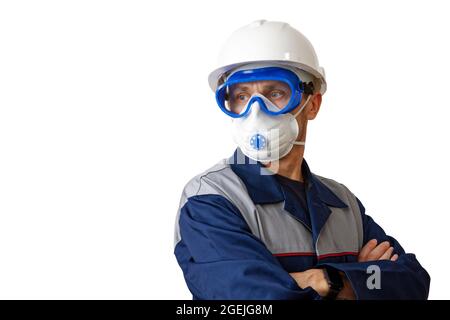 Portrait of a man in a work clothes, white construction helmet, respirator and protective glasses, isolated on white. Copyspace. Stock Photo