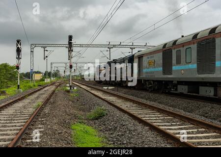 02413 Madgaon - New Delhi Rajdhani Special waiting at Kolad station on Konkan Railway. Stock Photo