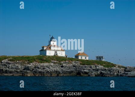 Egg Rock lighthouse sits on a rocky island in Acadia National Park, in Maine. The island is part of the Maine Coastal Islands National Wildlife Refuge Stock Photo