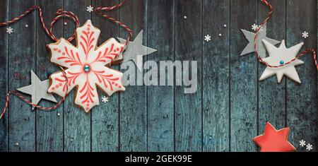 Christmas banner with iced biscuits. Snowflake shaped gingerbread cookies Stock Photo