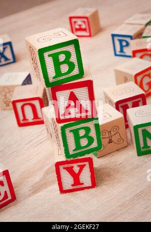 Toy blocks spelling out 'BABY' Stock Photo