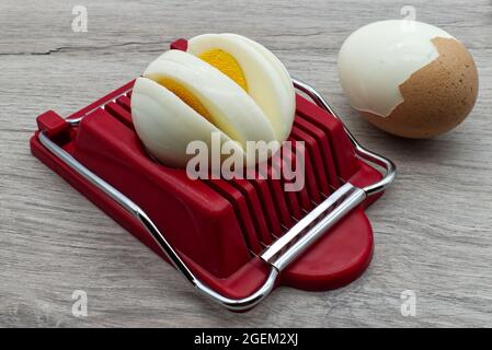 Household device for slicing eggs. Hard-boiled eggs slicer tool Stock Photo  - Alamy