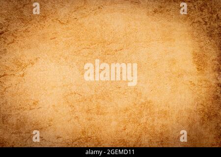 A sheet of blank, aged parchment paper for use as a background with complete copy space for use as a design element. Stock Photo