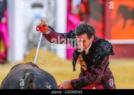 Malaga, Spain. 20th Aug, 2021. August 20, 2021: August 20, 2021 (Malaga)the bullfighter Juan Ortega toreo to idle with the cape, rocking the onslaught, recreating himself. several lances were real paintings. In the last third the bull started demanding everything from below because it had class and intention. A pity that the race prevented him from completing all the virtues that were appreciated. Ortega dosed him without finishing squeezing him, even managed to rip the music off, and even though in the fourth series the animal ended up slicing if it had been successful with steel it would hav Stock Photo