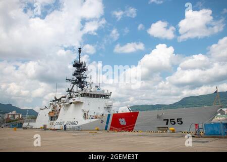 The U.S. Coast Guard cutter USCGC Munro (WMSL 755) is moored pierside during a visit to Commander, Fleet Activities Sasebo, Japan (CFAS) Aug. 20, 2021. The United States Coast Guard has a presence on all seven continents and the world’s oceans, projecting national sovereignty with icebreakers, national security cutters, high-endurance cutters, aviation assets, and deployable specialized forces. (U.S. Navy photo by Mass Communication Specialist 1st Class Jeremy Graham) Stock Photo