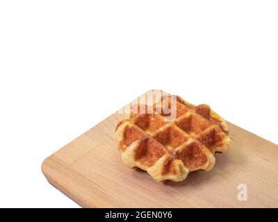 Round waffle, a close up of traditional homemade delicious crispy waffle cake dessert isolated on white background. Stock Photo