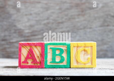 Color letter block in word abc on wood background Stock Photo