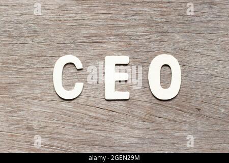 Alphabet letter in word CEO (Abbreviation of Chief Executive Officer) on wood background Stock Photo