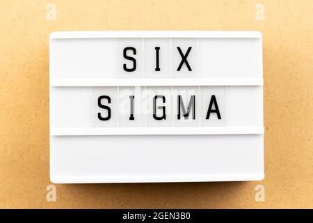 Light box with word six sigma on wood background Stock Photo