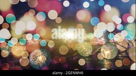 Book. Opened magic book with magic light. Abstract magic book on wooden background . Stock Photo