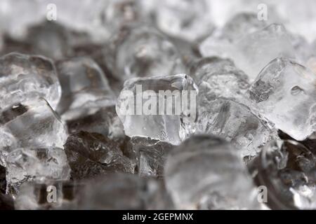 Ice cubes are seen melting. Macro shot. Stock Photo