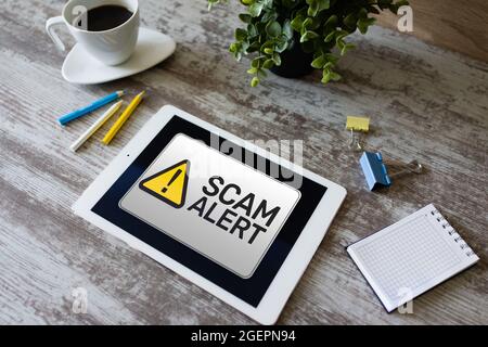 Scam alert detecting warning. Notification on device screen. Stock Photo