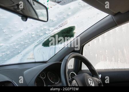 Cleaning a car in a hand car wash in the UK Stock Photo