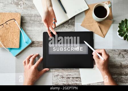 Subscribe button on device screen. Internet and digital marketing concept. Stock Photo