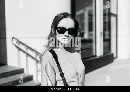 Caucasian girl looking at the camera and walking Stock Photo