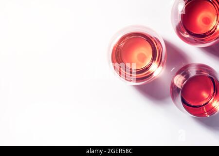 Rose wine of different shades in glasses on white background. Rosado, rosato or blush wines tasting Stock Photo