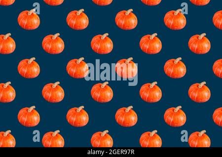 seamless pattern of orange pumpkin on dark blue color Stock Photo