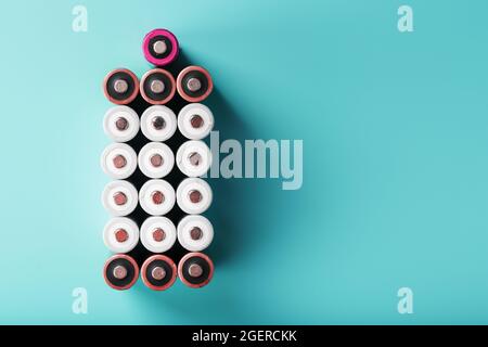 AA batteries are arranged in the form of a large battery on a blue background. Top view, free space. The concept of energy supply and utilization Stock Photo