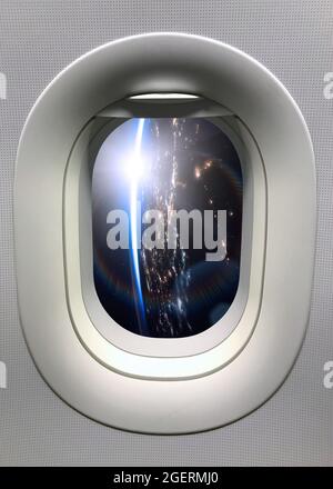 View from a porthole on the night Earth planet. Elements of this image furnished by NASA. Stock Photo