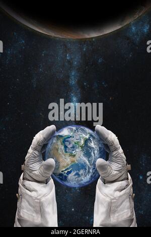 Earth in the hands of astronaut. Earth Day concept. Elements of this image furnished by NASA. Stock Photo