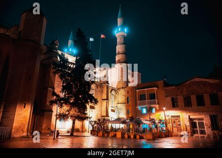 Selimiye Mosque, formerly St. Sophia Cathedral and nearby restaurant at night. Nicosia, Cyprus Stock Photo
