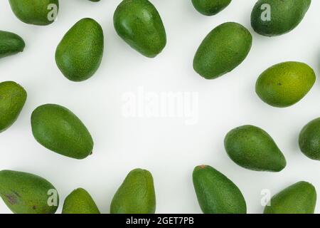 Avocado fruit frame on white background. Flat lay, top view. Food concept. Stock Photo