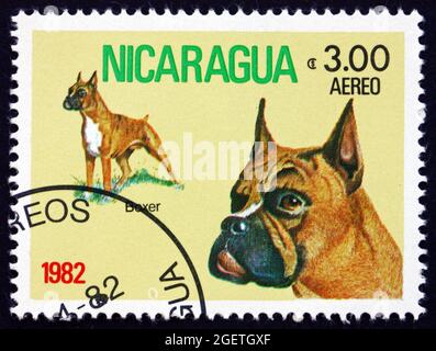 NICARAGUA - CIRCA 1982: a stamp printed in Nicaragua shows Boxer, Dog, circa 1982 Stock Photo