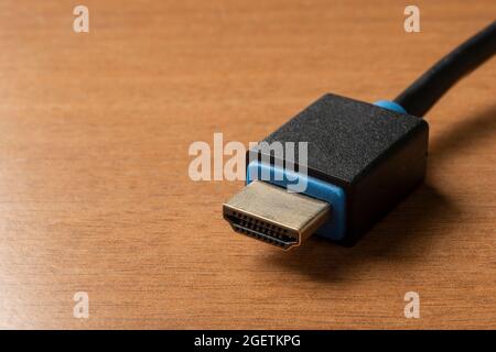 Hdmi (high definition multimedia interface) cable on wooden table Stock Photo
