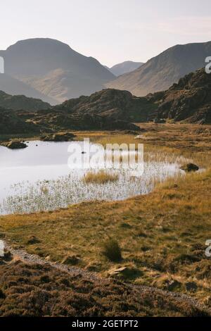 The Wasdale fells of Scafell, Kirk Fell and Pillar from Innominate Tarn on Haystacks, Lake District, UK Stock Photo