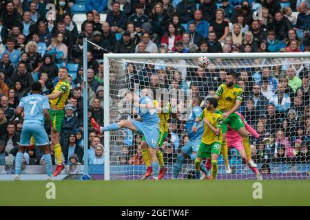 Manchester, UK. 21st Aug, 2021. Grant Hanley #5 of Norwich City makes a defensive clearance in Manchester, United Kingdom on 8/21/2021. (Photo by Conor Molloy/News Images/Sipa USA) Credit: Sipa USA/Alamy Live News Stock Photo