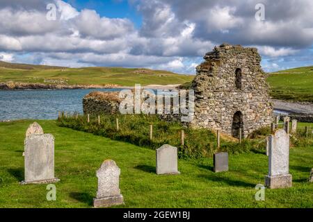 The picturesque ruins of medieval St Olaf's church on the coast at Lunda Wick on Unst, Shetland.