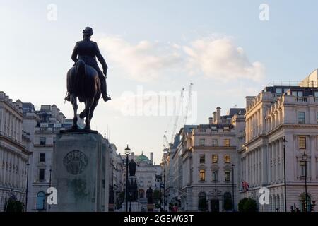 Waterloo Place. Equestrian Statue Edward VII, The Guards Crimean War Memorial. Piccadilly Circus behind. Stock Photo