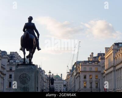 Waterloo Place. Equestrian Statue Edward VII, The Guards Crimean War Memorial. Piccadilly Circus behind. Stock Photo