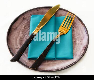 isolated dining cutlery and crockery set, knife and fork on a serving plate Stock Photo