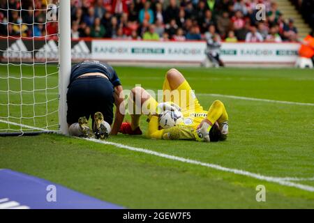 Sheffield, UK. 21st Aug, 2021. Lee Nicholls #21 of Huddersfield Town sustains a head injury in Sheffield, United Kingdom on 8/21/2021. (Photo by Ben Early/News Images/Sipa USA) Credit: Sipa USA/Alamy Live News Stock Photo