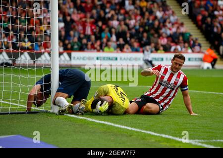 Sheffield, UK. 21st Aug, 2021. Lee Nicholls #21 of Huddersfield Town sustains a head injury in Sheffield, United Kingdom on 8/21/2021. (Photo by Ben Early/News Images/Sipa USA) Credit: Sipa USA/Alamy Live News Stock Photo