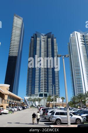 SUNNY ISLES, UNITED STATES - May 08, 2020: A view of highrise buildings from a parking lot in Sunny Isles, Florida, USA Stock Photo