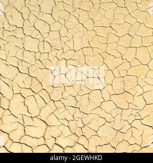 Surface of dried lake bed with cracks in mud. Natural background Stock Photo