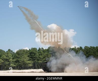 U.S. Marines with 2d Combat Engineer Battalion, 2d Marine Division, fire a mine clearing line charge (MCLC) on Camp Lejeune, N.C., Aug. 19, 2021. The MCLC is an explosive system that is fired to clear an 8-by-100 meter path for troops in combat. (U.S. Marine Corps photo by Lance Cpl. Brian Bolin Jr.) Stock Photo