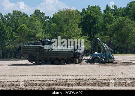 U.S. Marines with 2d Combat Engineer Battalion, 2d Marine Division, prepare to fire a mine clearing line charge (MCLC) on Camp Lejeune, N.C., Aug. 19, 2021. The MCLC is an explosive system that is fired to clear an 8-by-100 meter path for troops in combat. (U.S. Marine Corps photo by Lance Cpl. Brian Bolin Jr.) Stock Photo