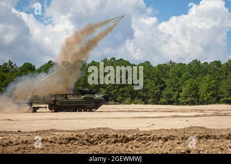 U.S. Marines with 2d Combat Engineer Battalion, 2d Marine Division, fire a mine clearing line charge (MCLC) on Camp Lejeune, N.C., Aug. 19, 2021. The MCLC is an explosive system that is fired to clear an 8-by-100 meter path for troops in combat. (U.S. Marine Corps photo by 2nd Lt. William Reckley) Stock Photo